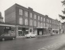 The Strand, Exmouth, 1960: row of shops and garage