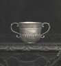 Silver fluted Queen Anne Porringer: Made by John Elston.  Hallmarked in Exeter in 1712.  Now in the Exeter Museum.
